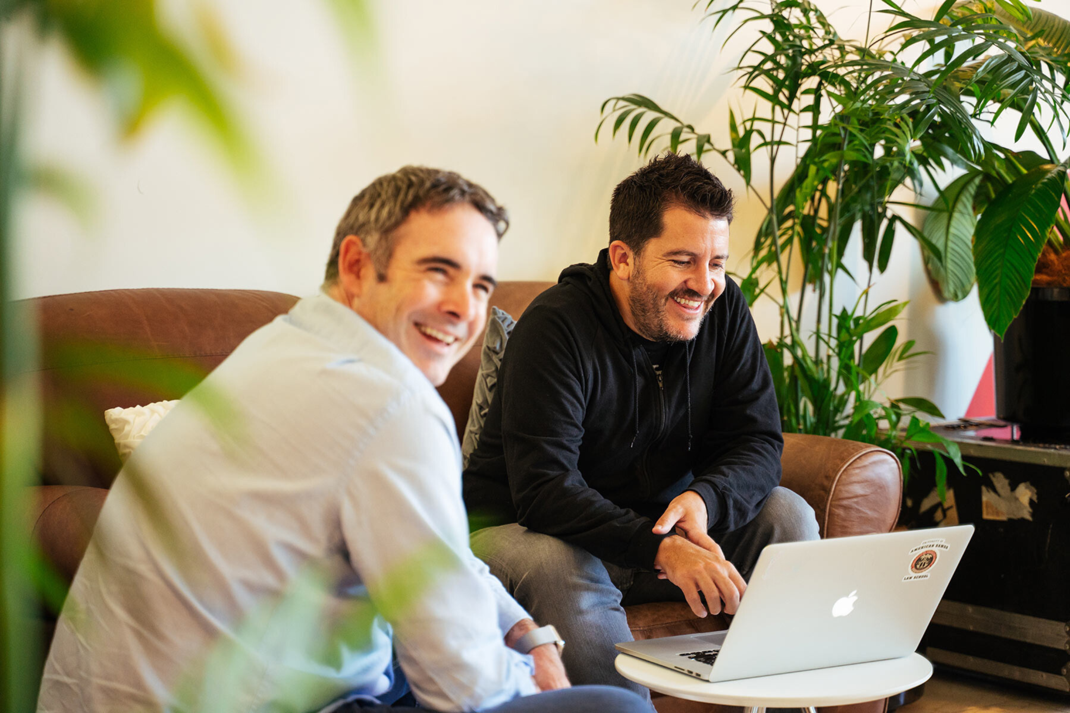 Learnosity co-founders Gav & Mark working together over a laptop.