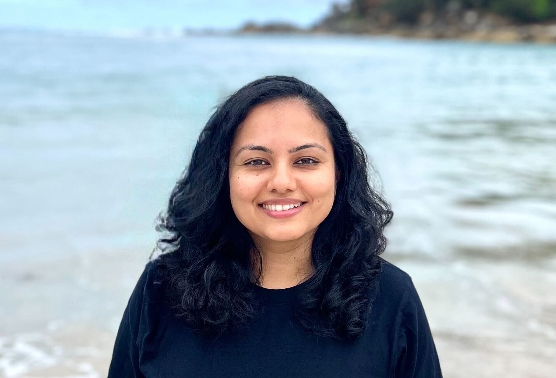 Photo of Shruthi on beach.